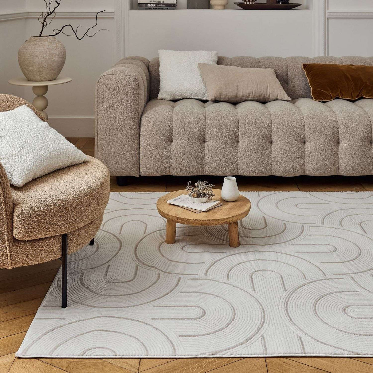 Stylish geometric rug on wooden floor beneath a modern sofa, ideal for contemporary living spaces