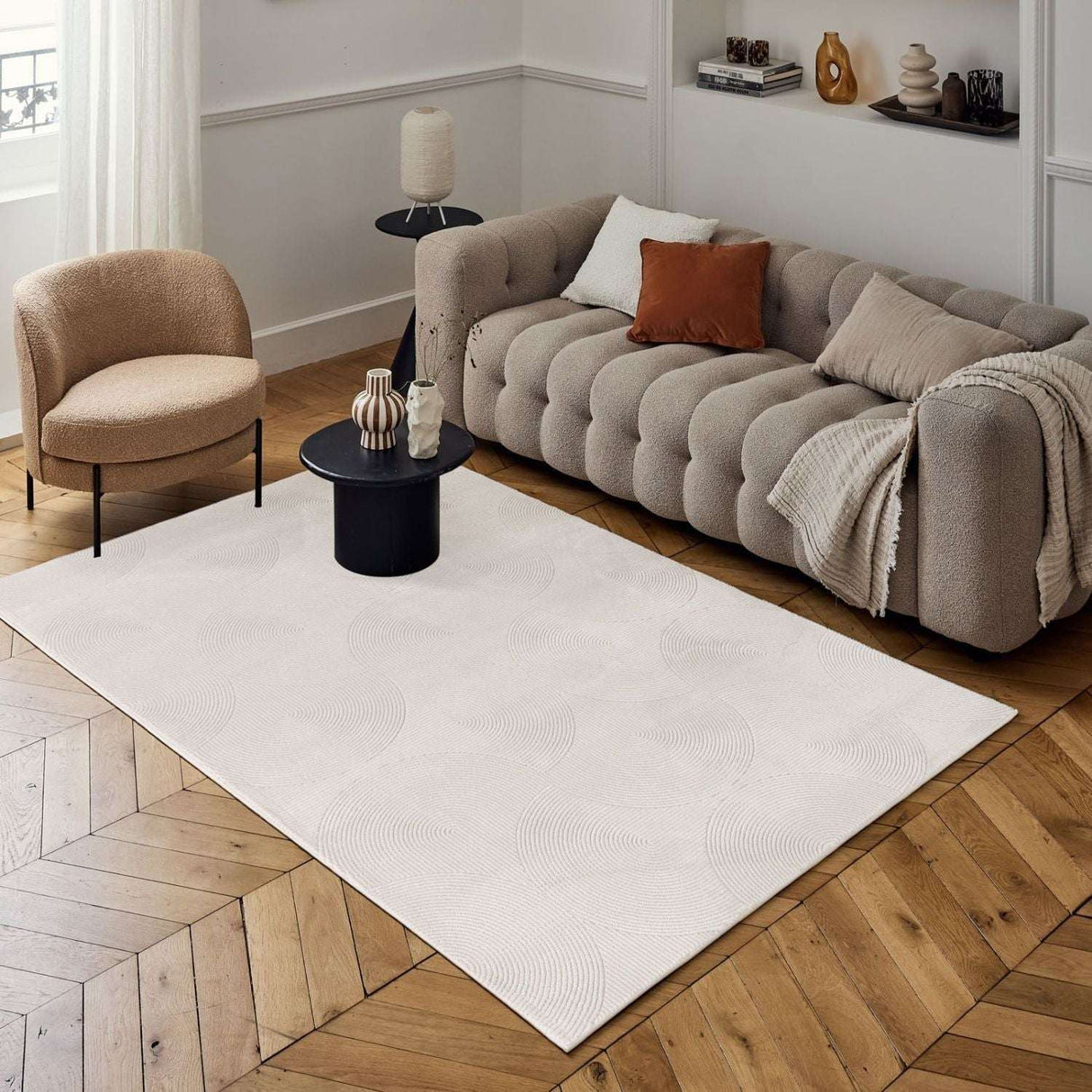 Elegant Geometric Rug in a Modern Living Room Setting with Neutral Tones and Wooden Flooring