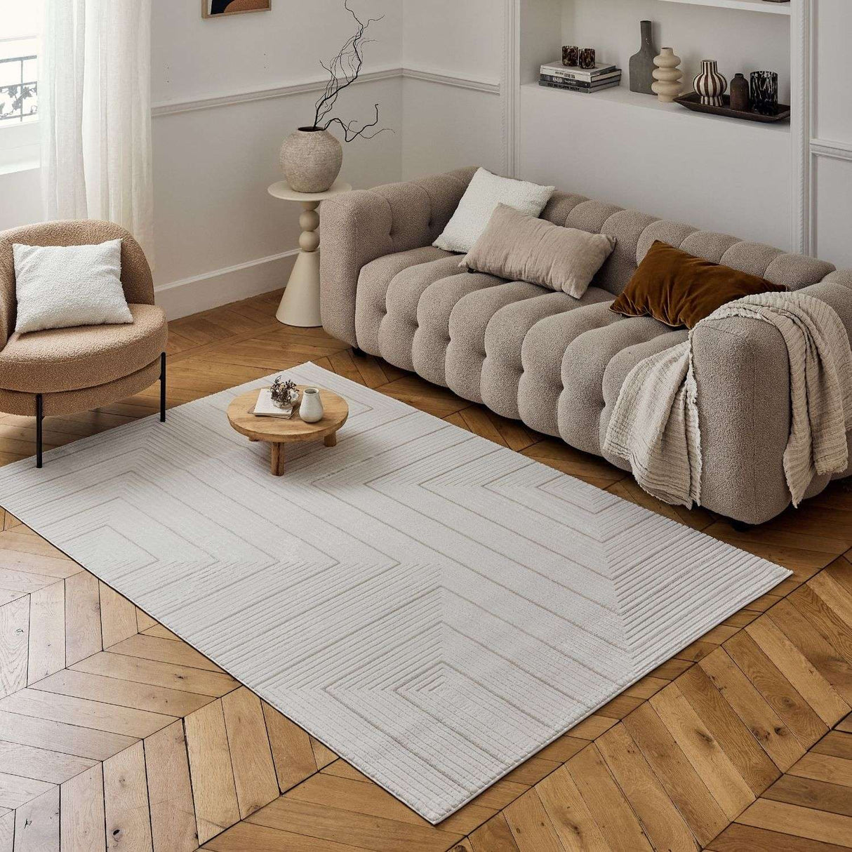 Stylish Geometric Rug in a neutral shade, enhancing a modern lounge with textured wood flooring