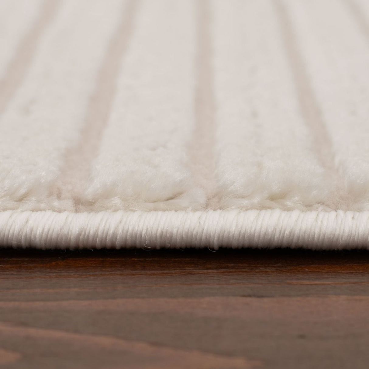 Soft white Geometric Rug with subtle textures, perfect for contemporary home decor