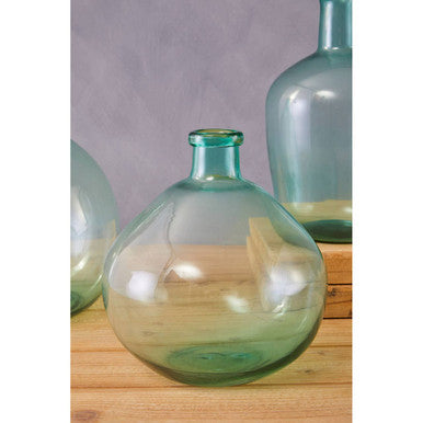 Orsina Glass Vase in an elegant round shape with a soft green hue for decorative styling