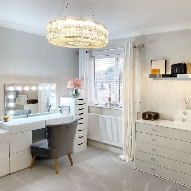 Modern vanity area with a Hollywood Mirror, stylish furniture, and elegant decor for a chic makeup space