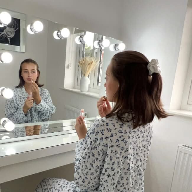 Elegant Hollywood Mirror with LED Lights for makeup application in a stylish vanity setting