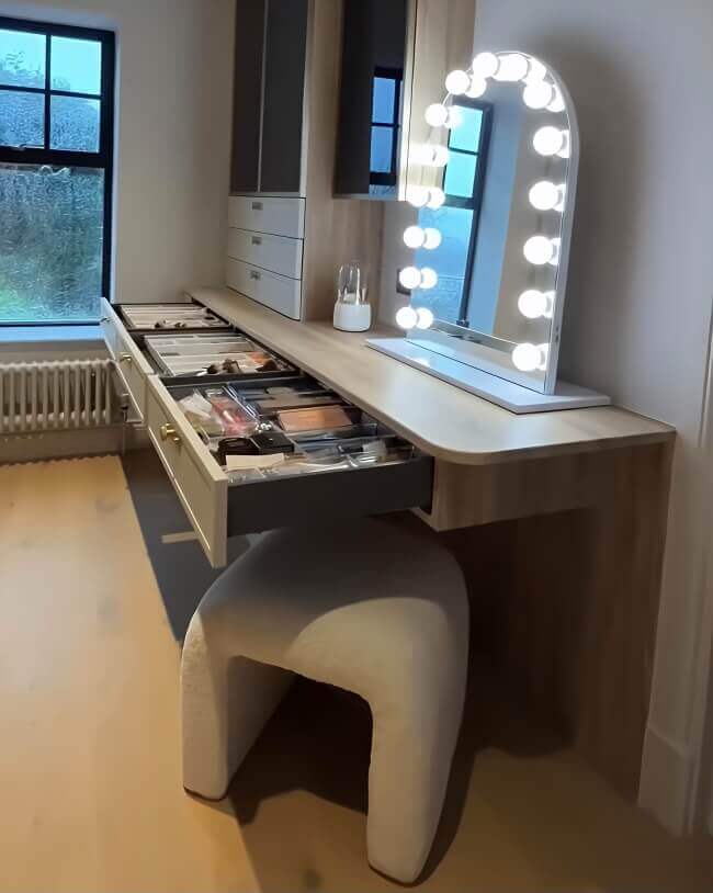 Elegant Hollywood Mirror with LED lights set above a stylish makeup vanity with drawers