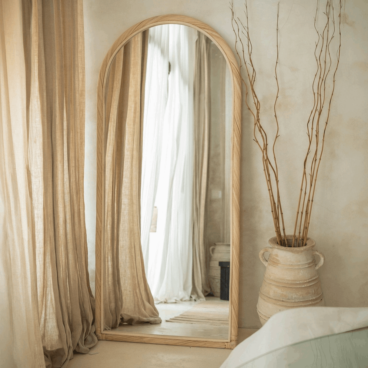 Elegant The Bali Concept Mirror with an arched wooden frame for a stylish home interior