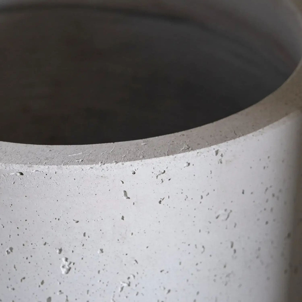 Close-up of a textured grey Cylinder Planter from Jobu Home with a modern design