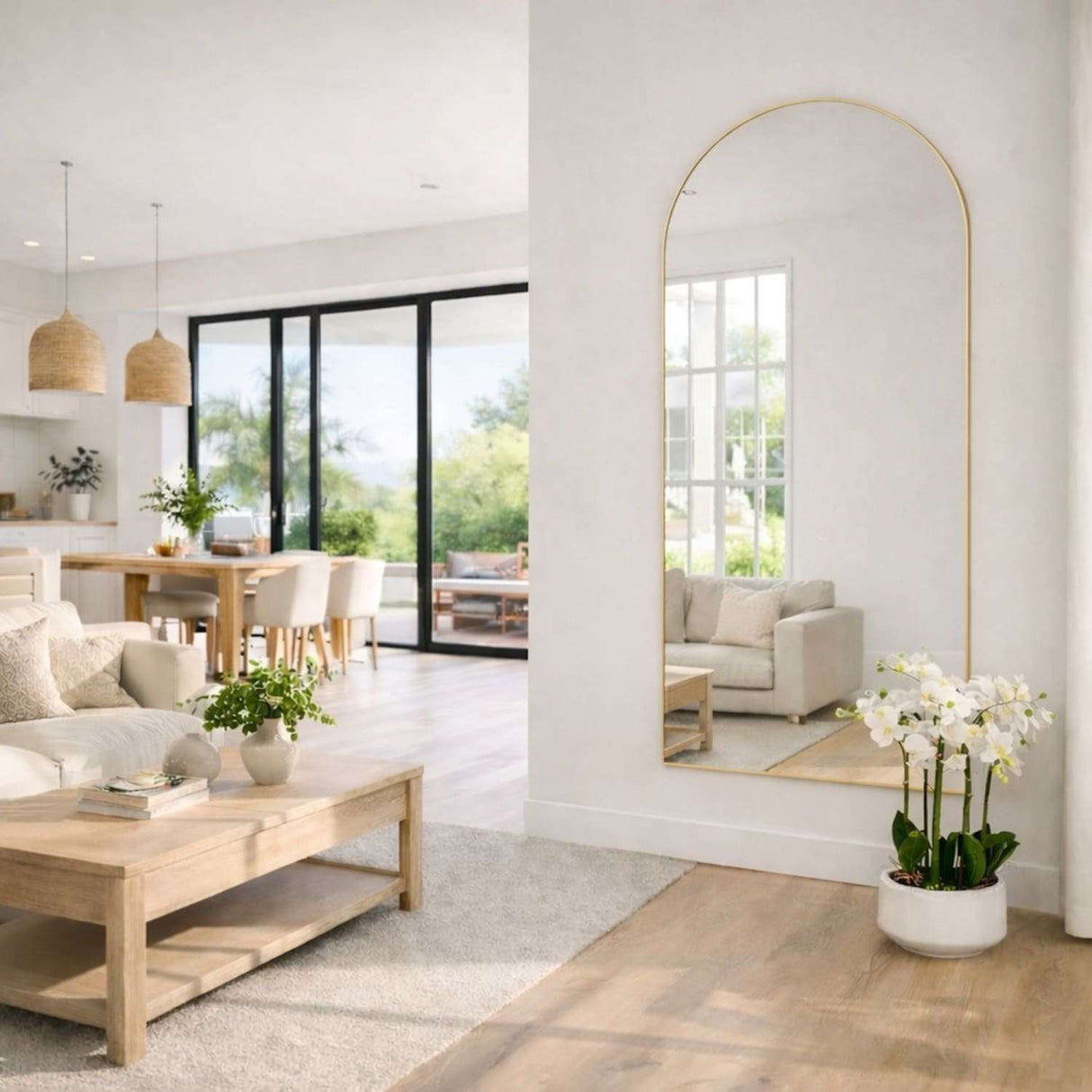 Jobu Home Arched Mirror in a modern living room reflecting natural light and decor