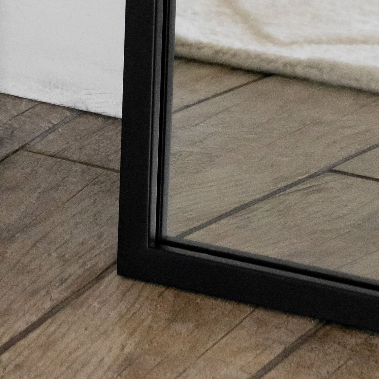 Jobu Home Arched Mirror with a sleek black frame, perfect for adding elegance to any room
