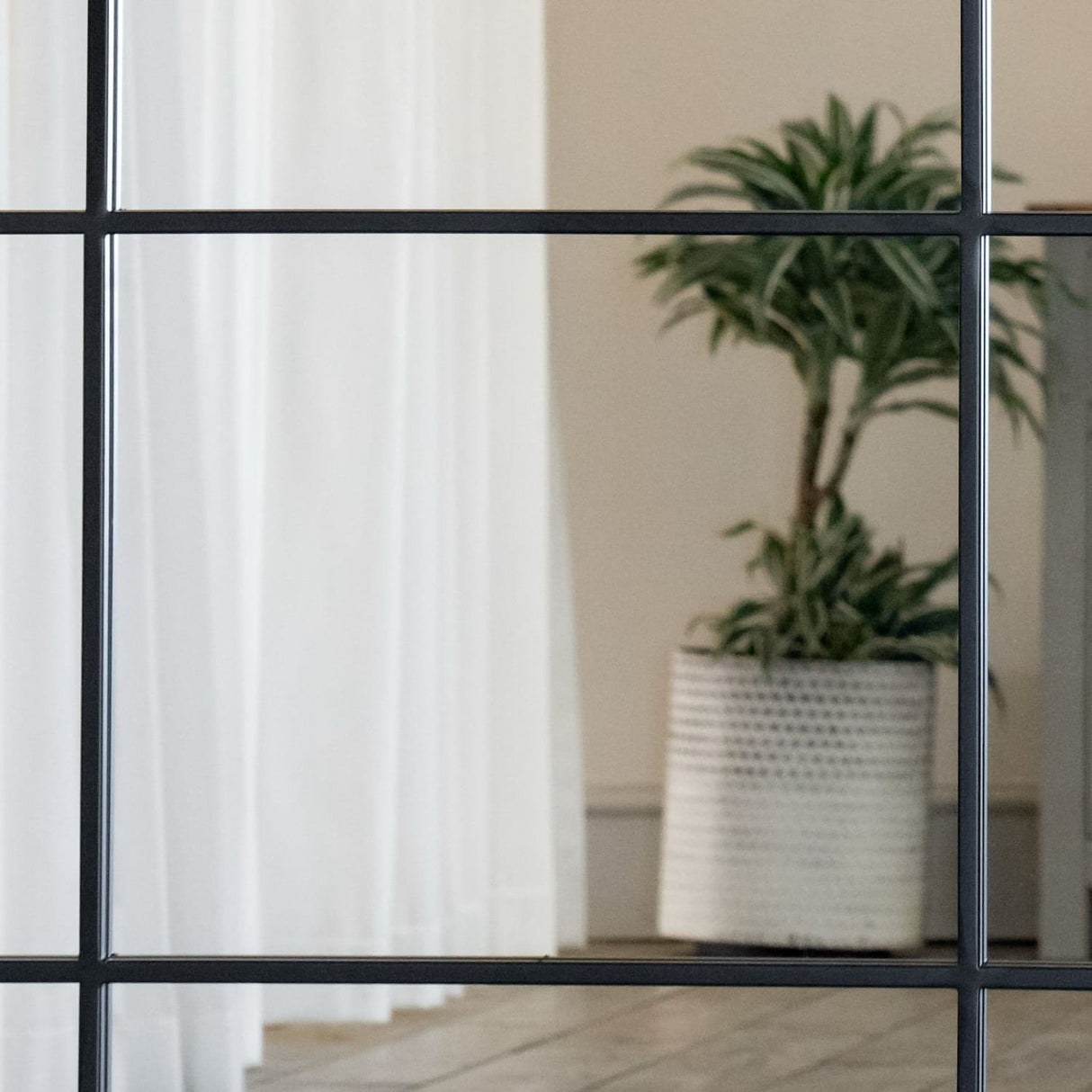 Jobu Home Lattice Grid Mirror with a stylish black frame and minimalist design, enhancing interior spaces