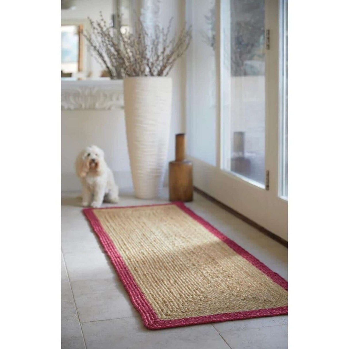 Natural fibre Jute Rug with a vibrant pink border, perfect for entryways and living spaces