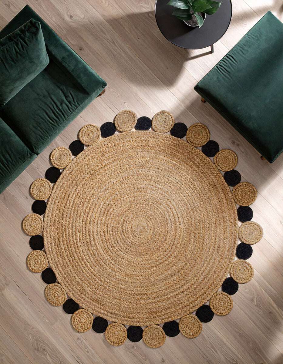 Orsina Jute Rug with a round design and black circular accents, perfect for stylish living spaces