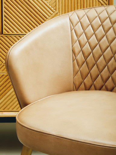 Orsina Leather Chair with a stylish diamond quilted design and smooth surface finish