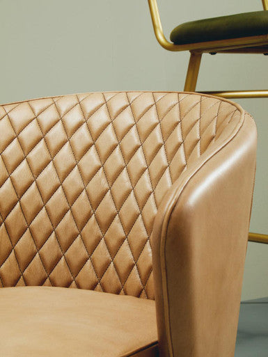 Stylish Orsina Leather Chair with a quilted design for elegant living spaces