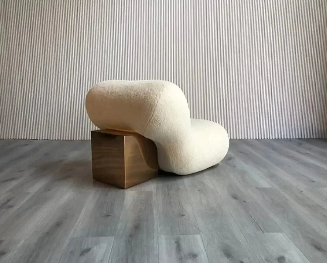 Elegant Nisu Home Lounge Chair with a Curved Design and Gold Accent for Modern Interiors