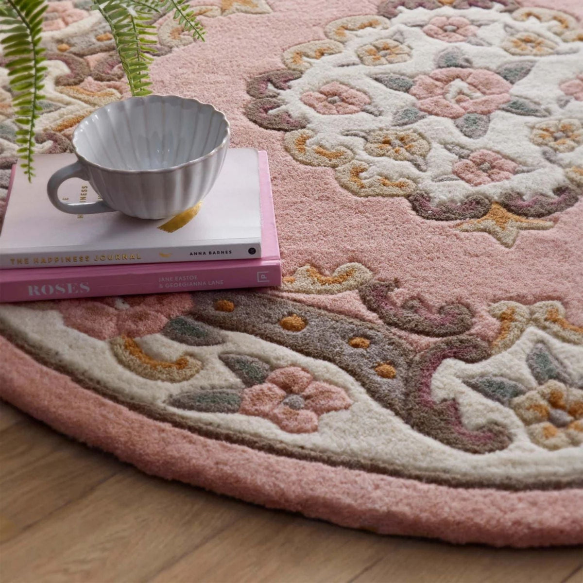 Elegant Medallion Rug in soft pink tones with floral patterns, perfect for a stylish home decor