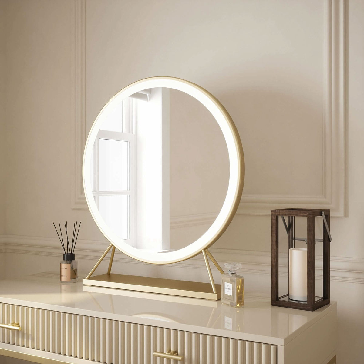 Stylish round Hollywood mirror with warm LED lighting on a modern console table