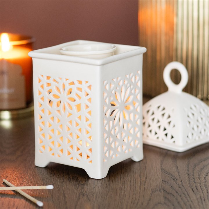 Elegant white ceramic multi-purpose burner with decorative cutout design for wax melts and essential oils
