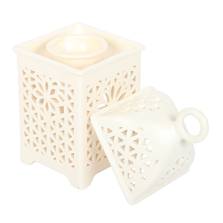 Elegant white multi-purpose burner with intricate cut-out design for home fragrance and decorative use