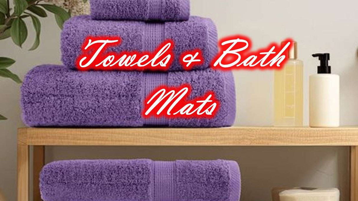 OLIVIA ROCCO Cotton Towels Set in Purple Displayed on a Wooden Shelf with Bath Products