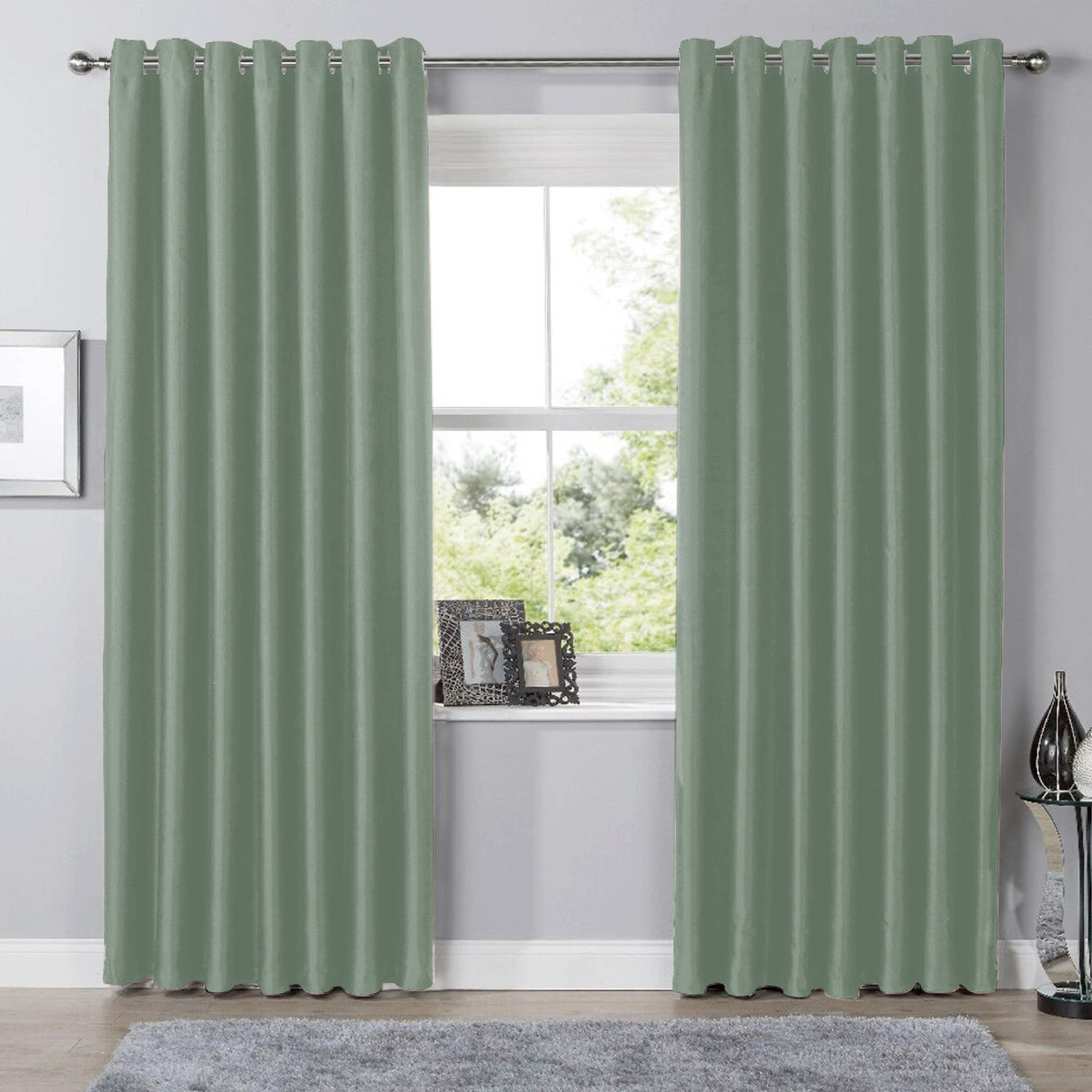 Olivia Rocco Eyelet Curtains in soft green colour, perfect for adding elegance to any room