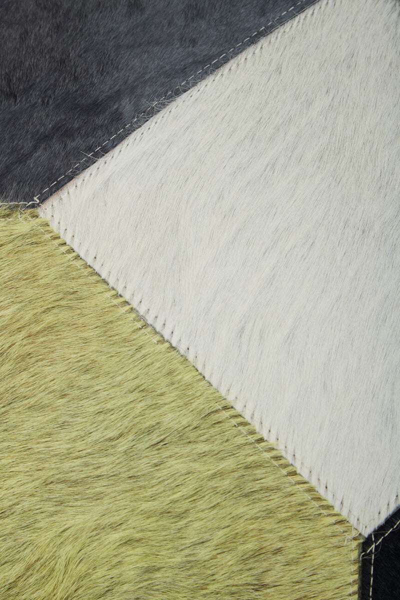 Close-up of Orsina Patchwork Cushion featuring unique fur patterns and textures in vibrant colours