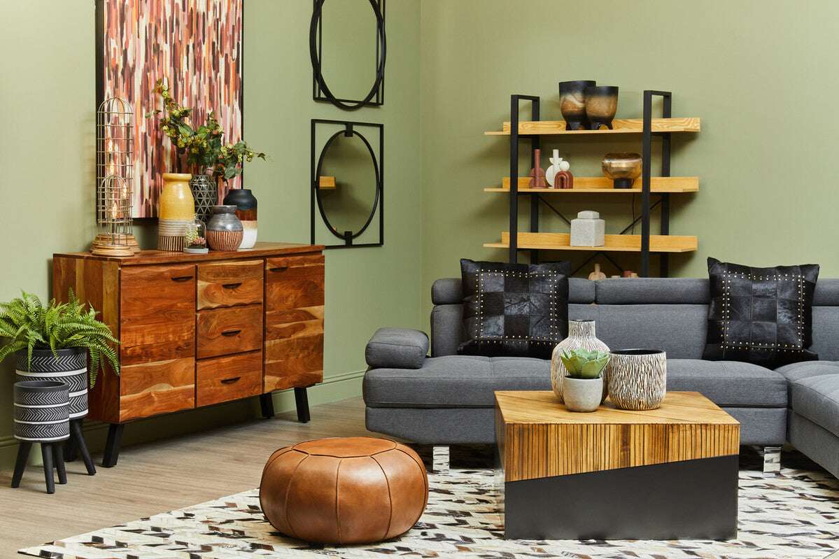 Stylish living room featuring Orsina Patchwork Cushion on a grey sofa with decorative items