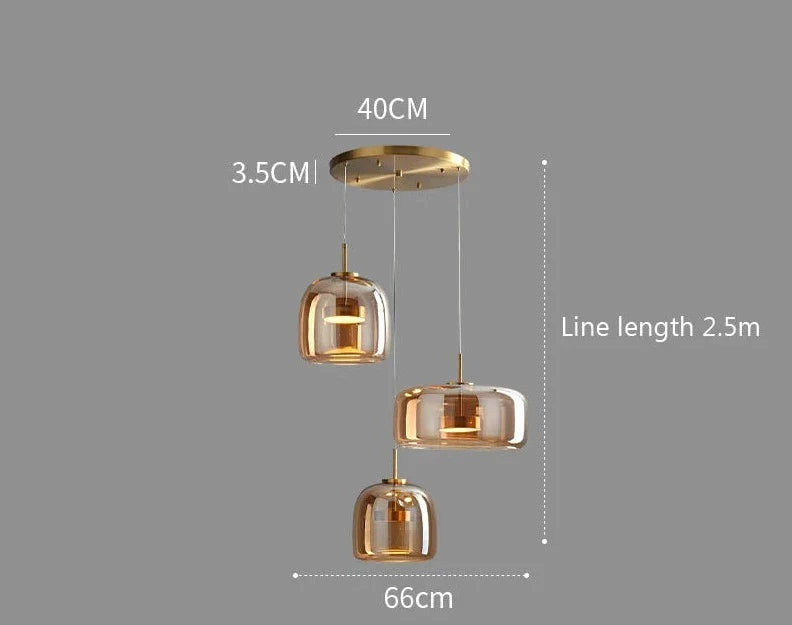 Nisu Home Pendant Light with three glass shades and a gold ceiling mount, ideal for modern interiors