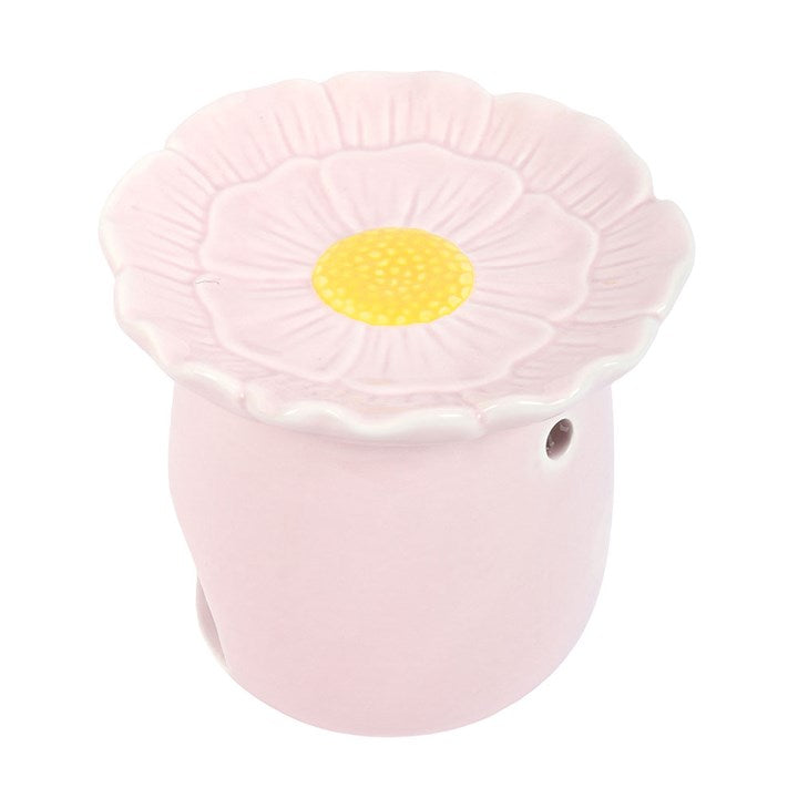 Pretty pink ceramic oil burner with a flower design for home fragrance and relaxation