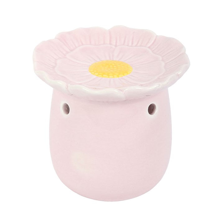 Pink ceramic oil burner in flower shape for fragrant essential oils and home aromatherapy