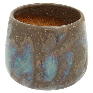 Orsina ceramic planter with a unique iridescent finish and rounded shape for indoor plants