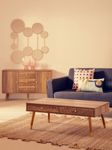 Orsina Rectangular Cushion in pastel colours placed on a navy sofa in a stylish living room setting
