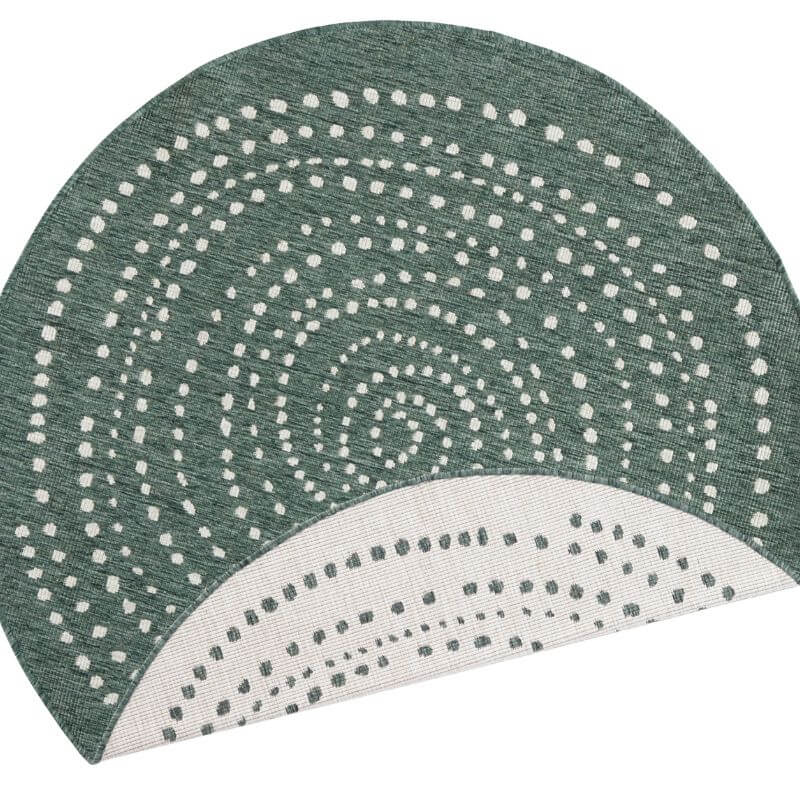 Stylish round rug with a patterned swirl design in green and white for modern home decor