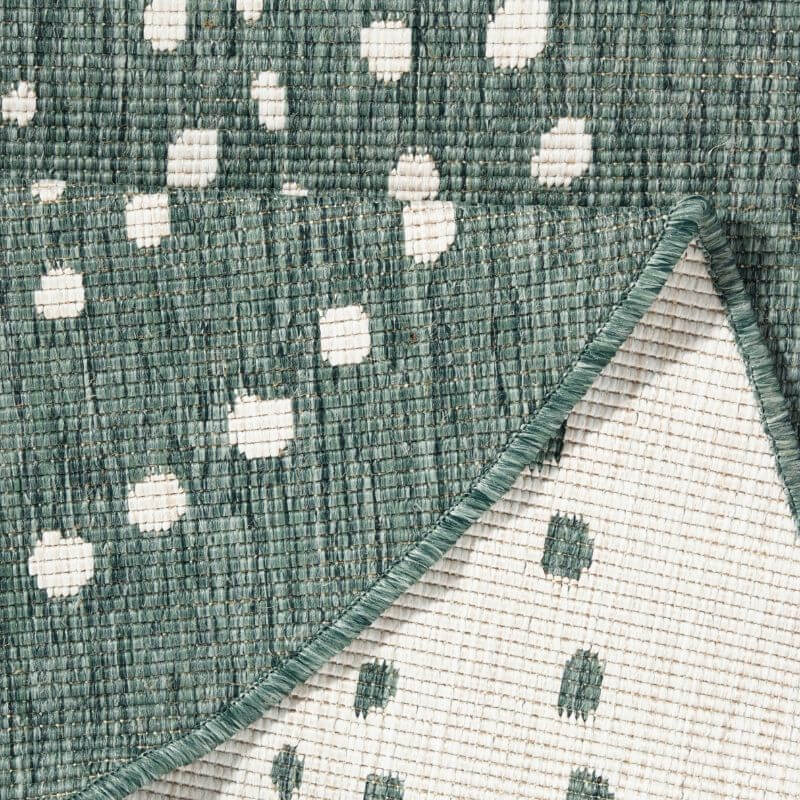 Textured green and white Round Rug with a modern polka dot design for stylish home decor