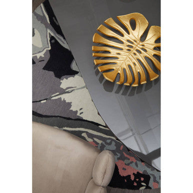 Orsina round rug featuring a modern design beneath a coffee table with a decorative bowl