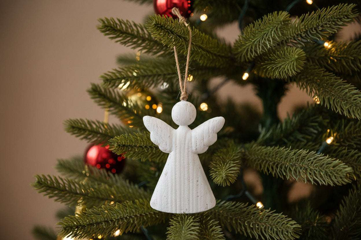Rustic Hanging Angel Christmas bauble decoration on a festive tree with red ornaments