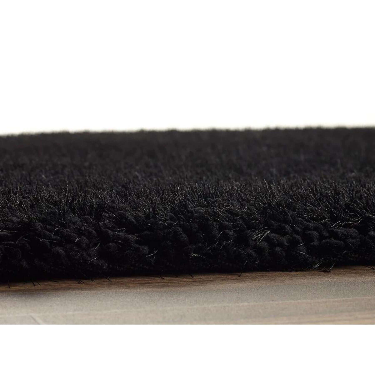 Soft black shaggy rug with plush texture, perfect for adding comfort to any living space