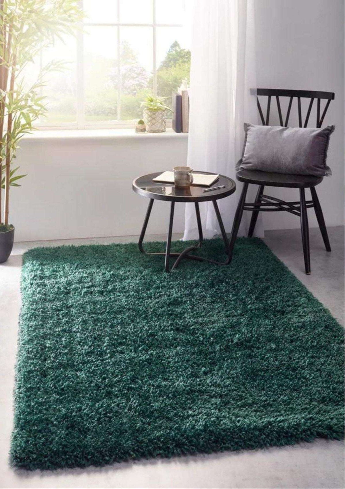 Green Shaggy Rug in a Modern Living Room Setting with a Chair and Side Table