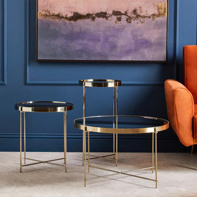 Set of three stylish Orsina side tables with gold frames and glass tops for modern decor