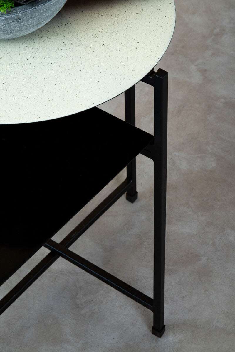 Orsina Side Table with a sleek black base and a speckled white tabletop design