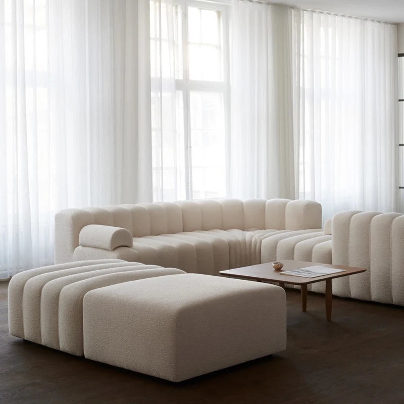 Modern Nisu Home Sofa in a neutral colour with curved shapes and plush fabric for stylish living rooms