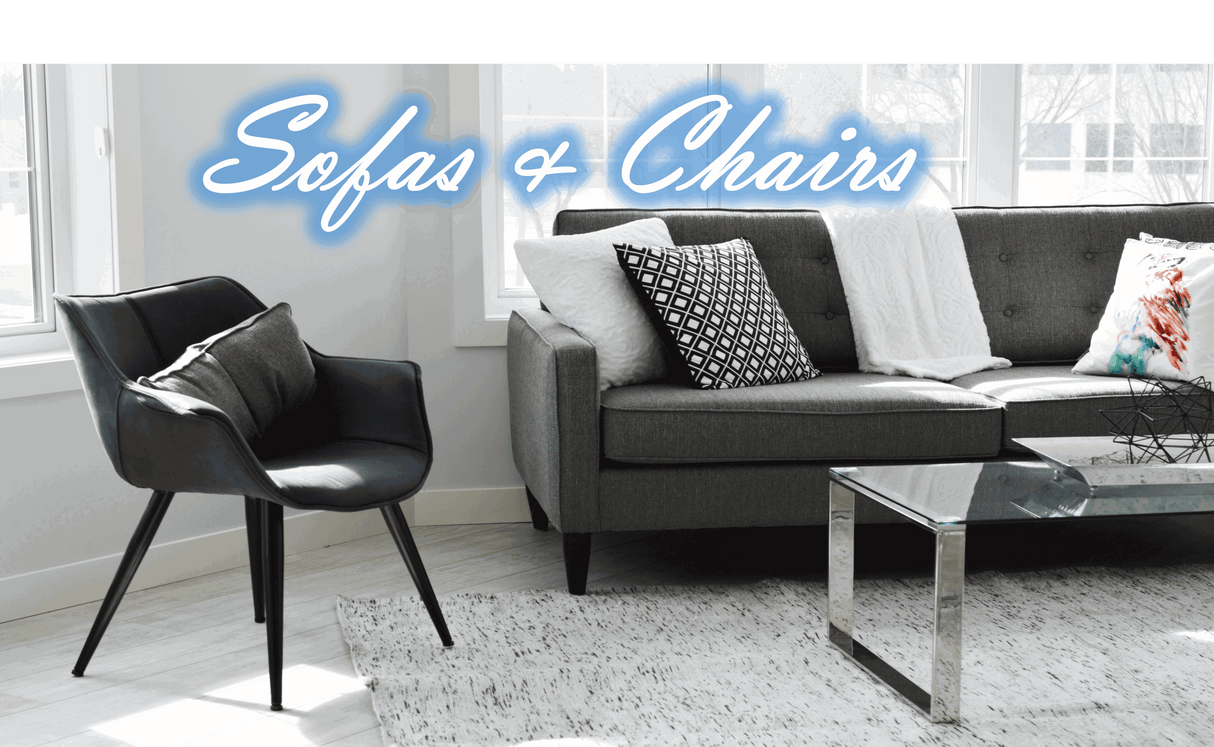 Stylish Nisu Home sofa featuring grey upholstery and decorative cushions in a modern living room setting