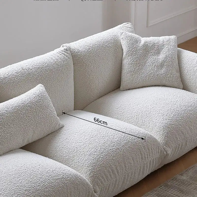 Nisu Home Sofa in white with soft textured fabric and plush cushions for comfortable seating