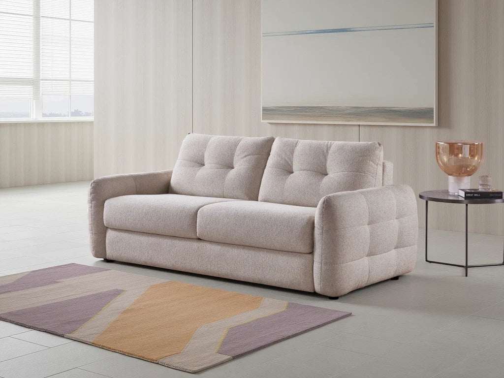 Stylish and comfortable beige sofabed with tufted cushions perfect for living rooms