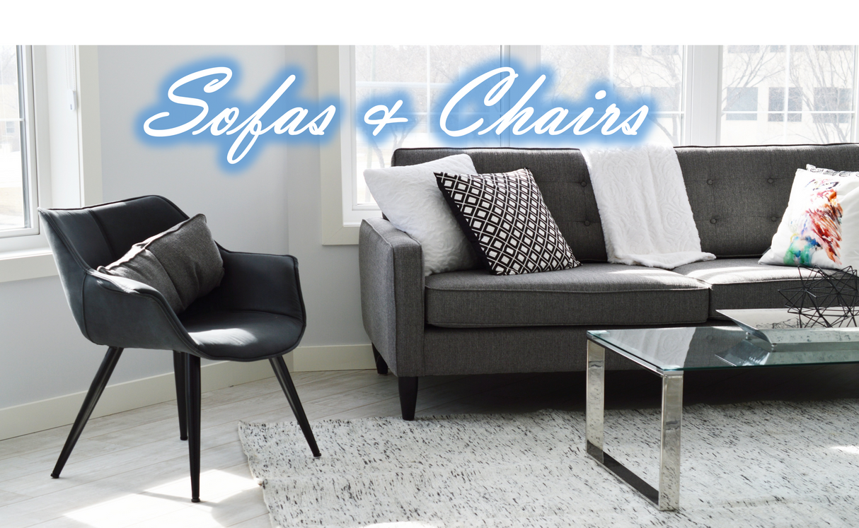 Stylish black Folding Chair beside a modern grey sofa with decorative cushions