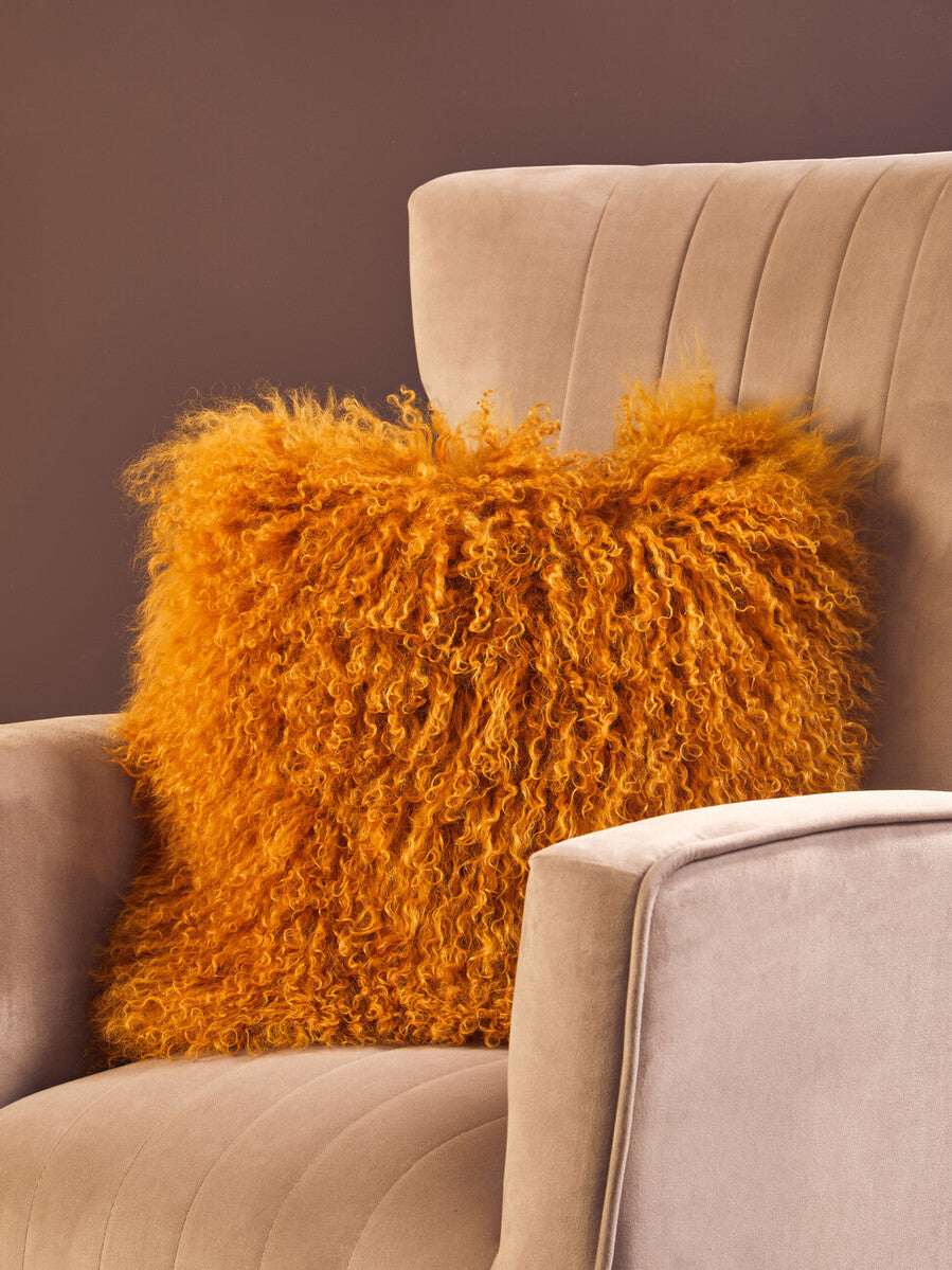 Orsina Square Cushion in vibrant orange with textured, fluffy design for stylish home decor
