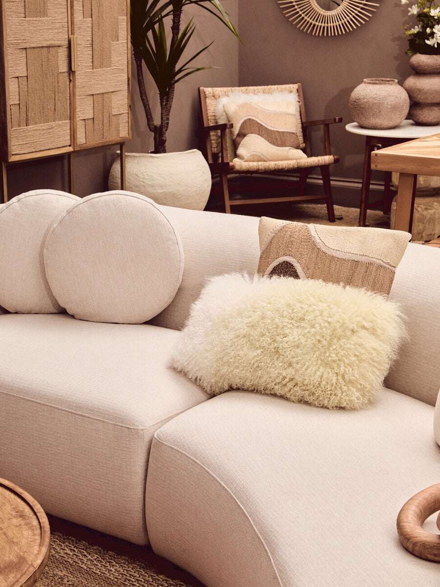 Orsina Square Cushion in a cosy living room setting with circular cushions and stylish decor