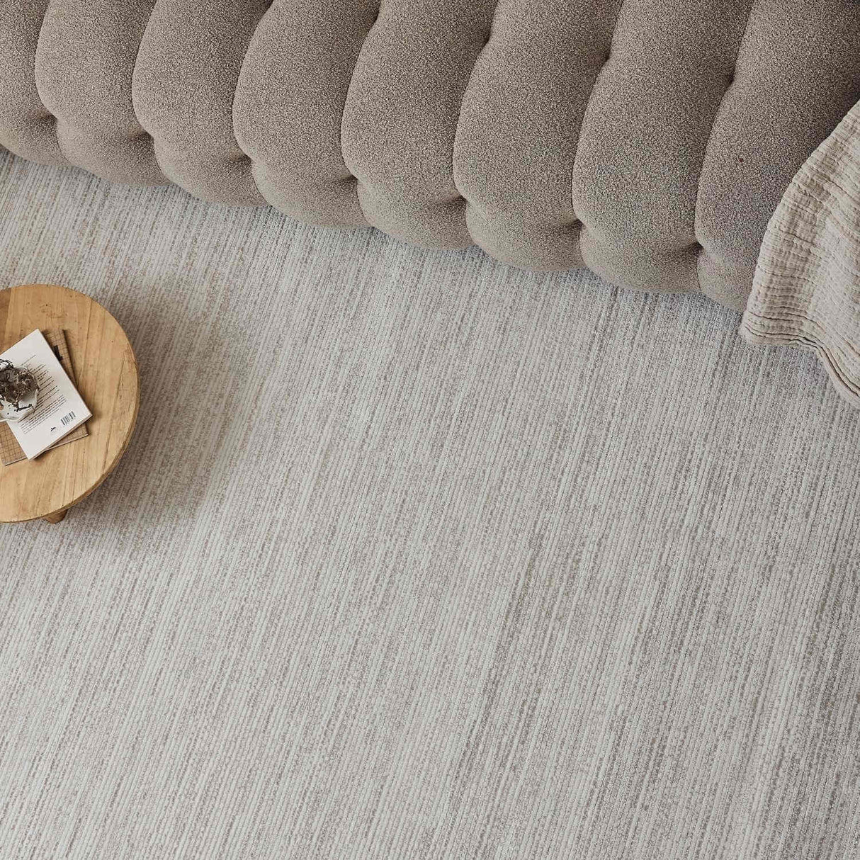 Neutral Striped Rug complementing a stylish sofa and wooden coffee table in a modern living room