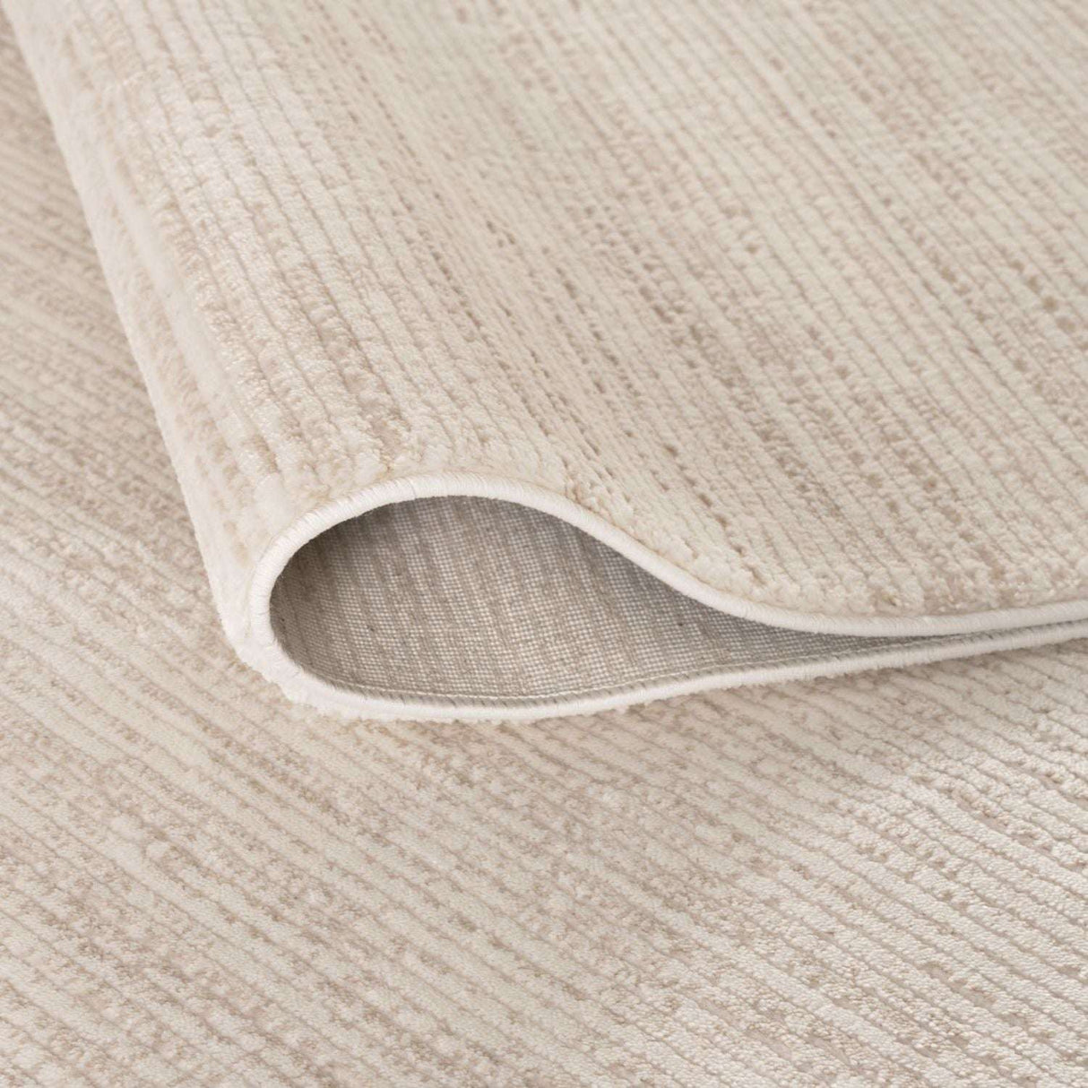 Soft beige Striped Rug with a textured surface, ideal for adding warmth to any room