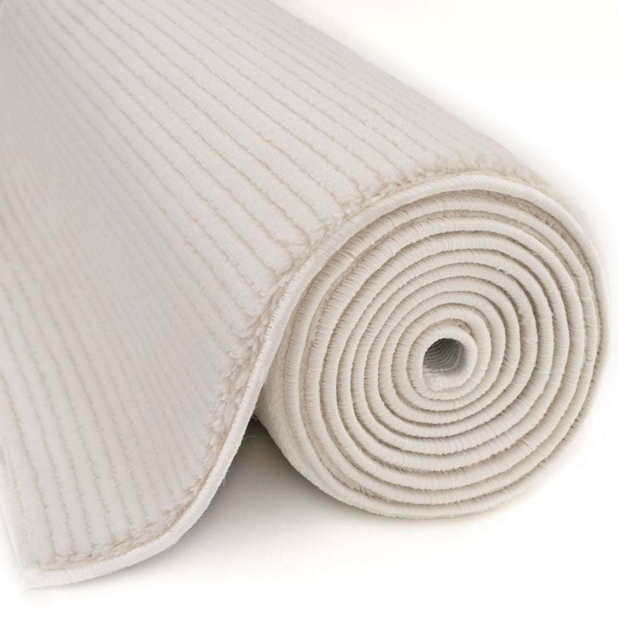 Cream Striped Rug rolled up, showcasing its soft texture and modern design for home decor