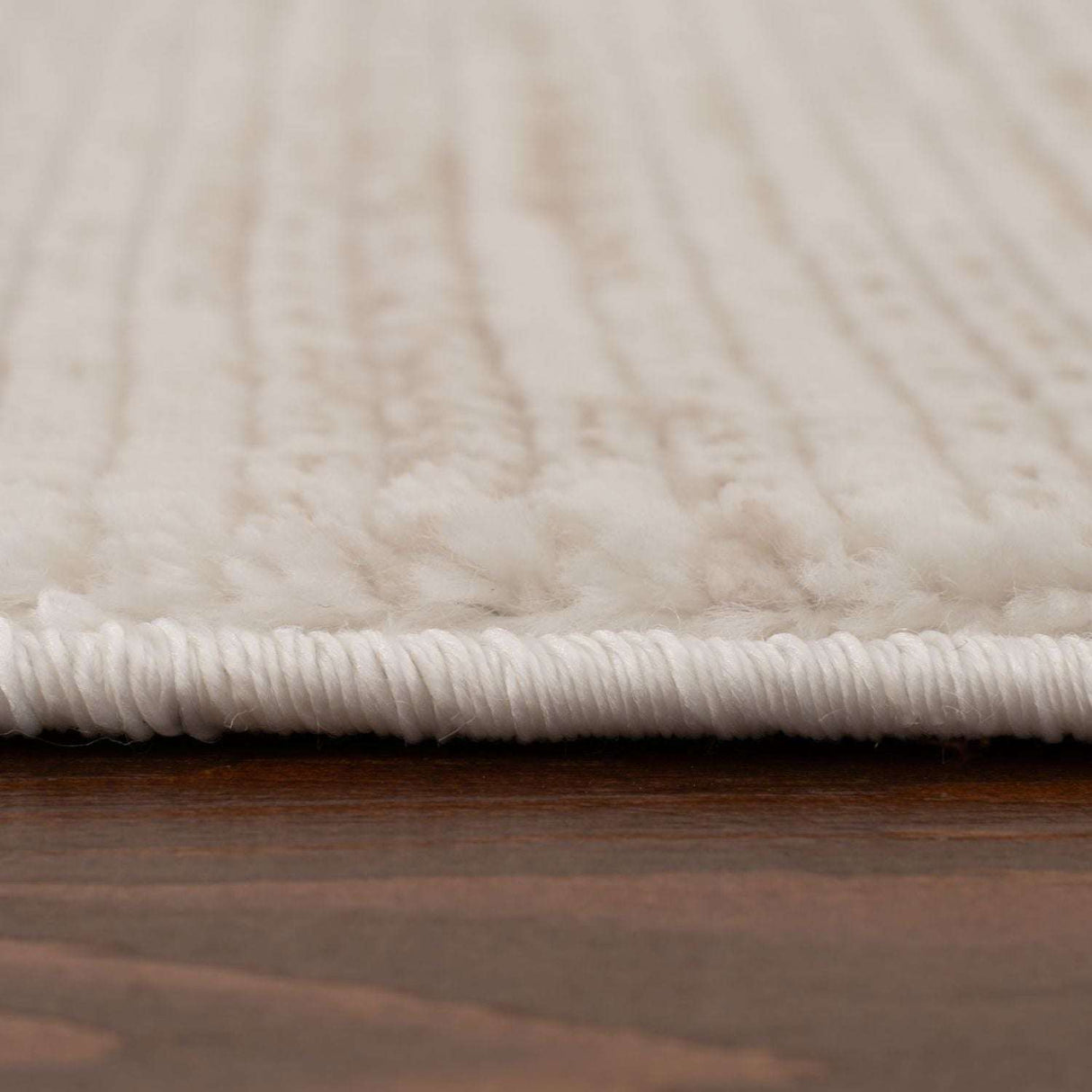 Close-up of a soft Striped Rug with a textured pattern for stylish home decor